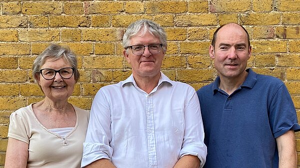 Lib Dem councillors for Epping East standing in front of brick wall