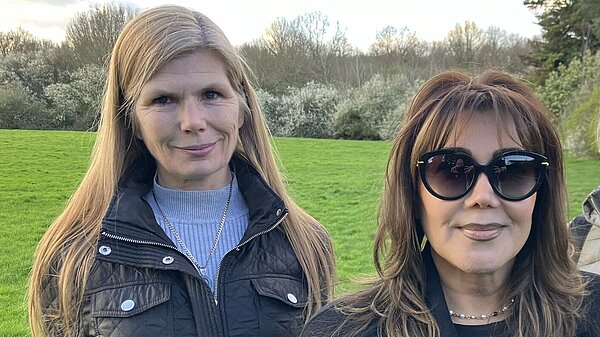 Councillor Mandy George and Councillor Razia Sharif with field and hedge in background